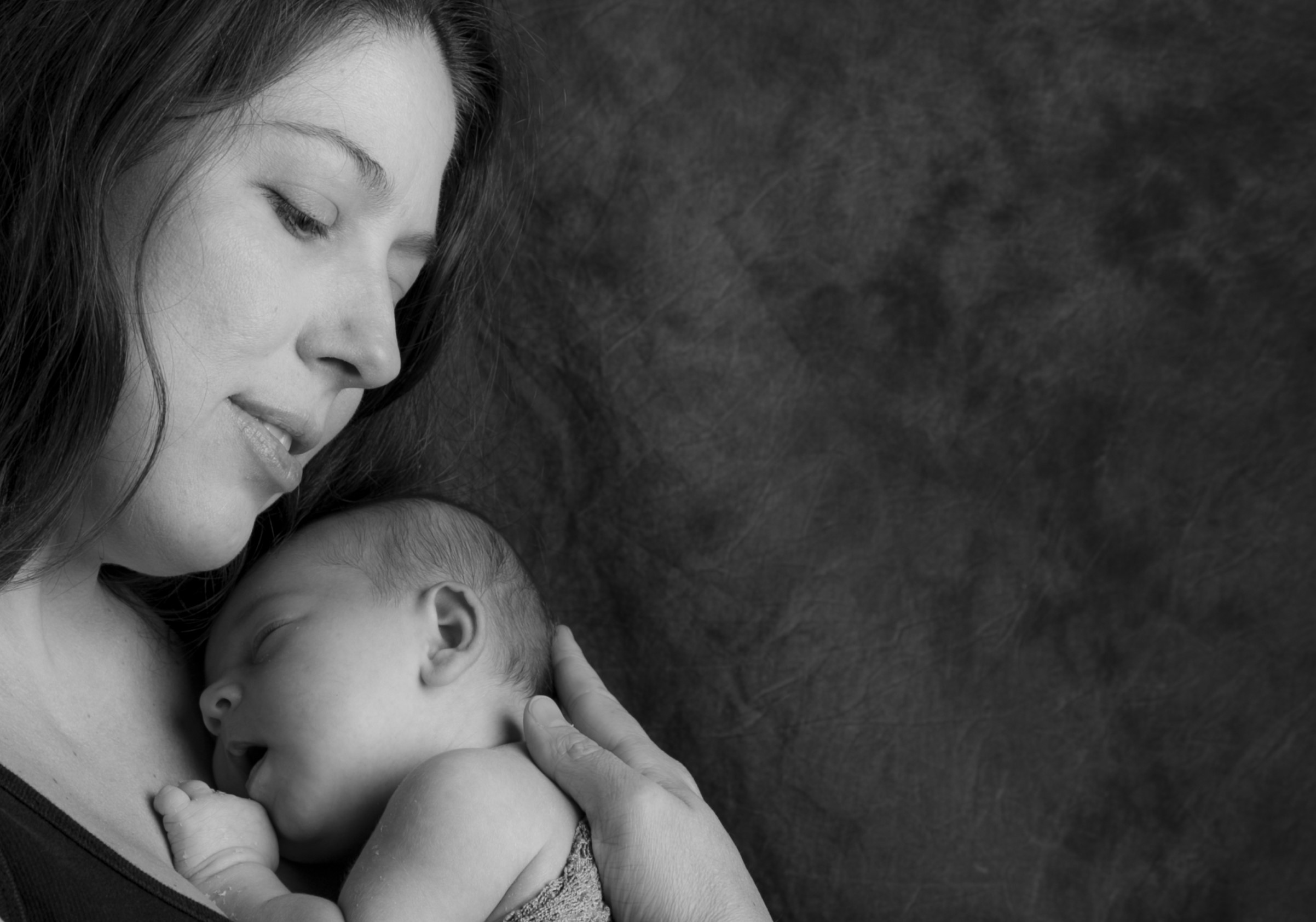 Mother holding her newborn baby in a tender moment